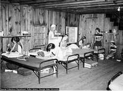 YWCA girls inside cabin at Camp Highland